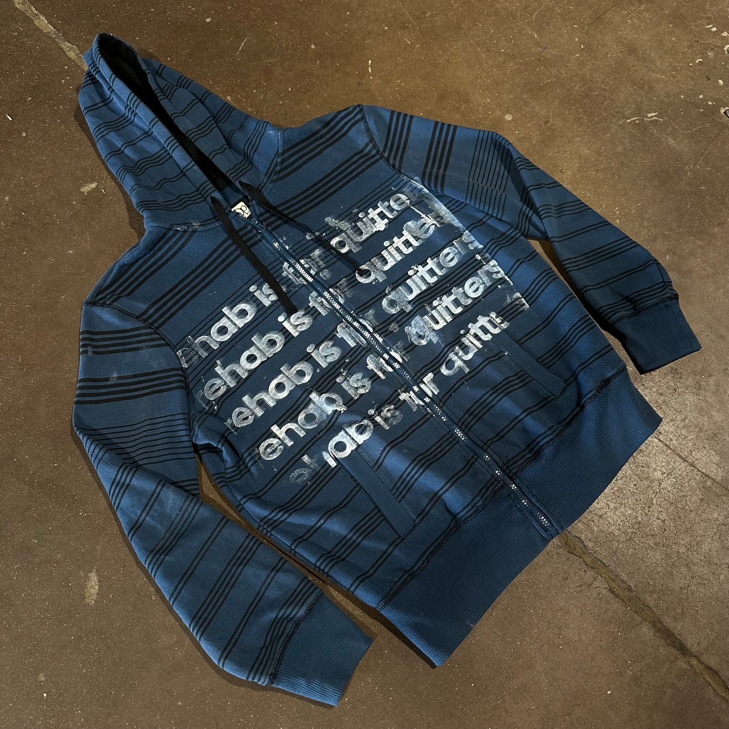 BLUE STRIPE REHAB IS FOR QUITTERS ZIP UP